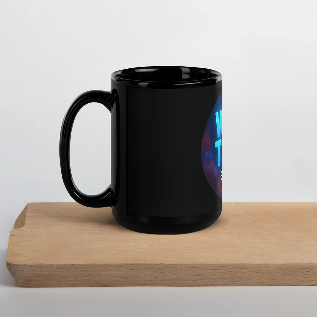 Black glossy mug with partial What Then Studio logo on wooden tray
