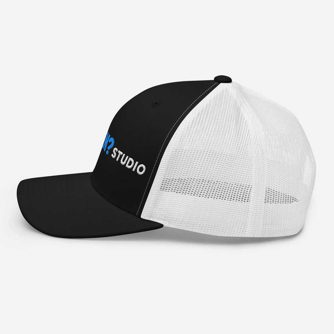 Black and white mesh retro trucker hat with What Then? Studio logo on left front panel
