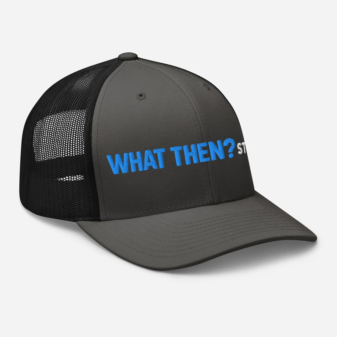 Charcoal and black mesh retro trucker hat with blue What Then? Studio logo, front-right view