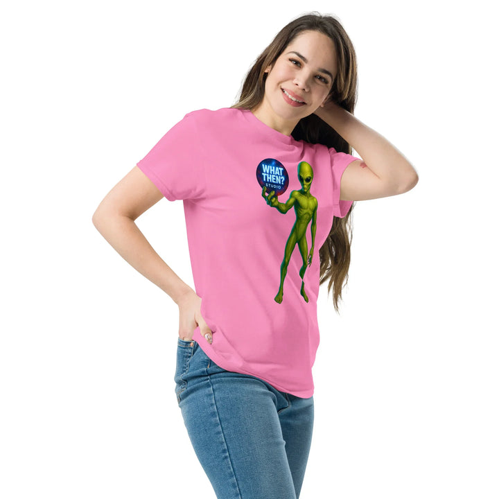 Woman in pink What Then Studio t-shirt with green alien graphic holding a logo bubble