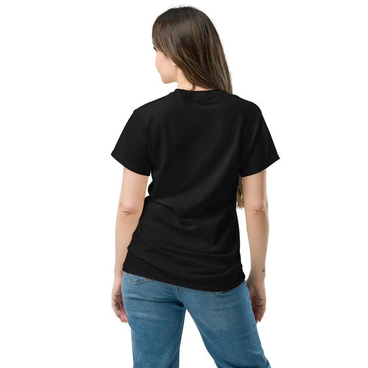 Woman wearing black unisex classic tee and jeans, back view, What Then Studio apparel