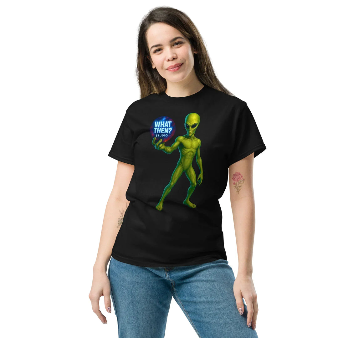Woman wearing black What Then Studio T-shirt with green alien graphic and blue logo
