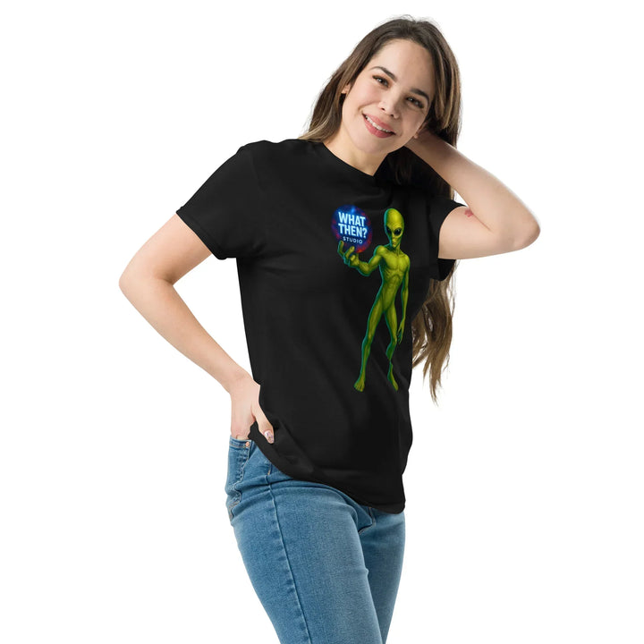 Woman wearing black What Then Studio t-shirt with green alien graphic and logo