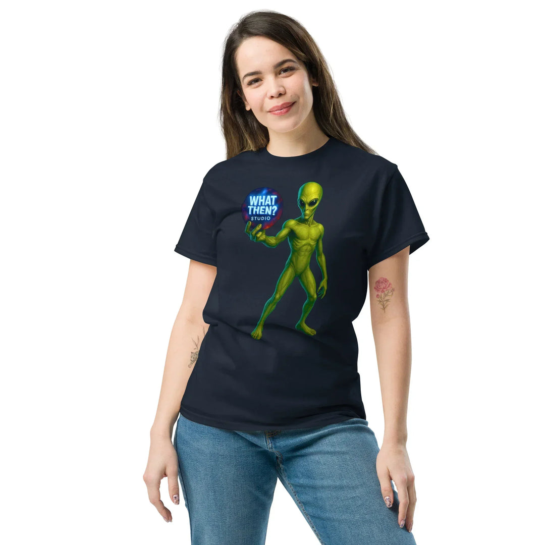 Woman wearing navy unisex t-shirt with green alien and 'What Then? Studio' graphic