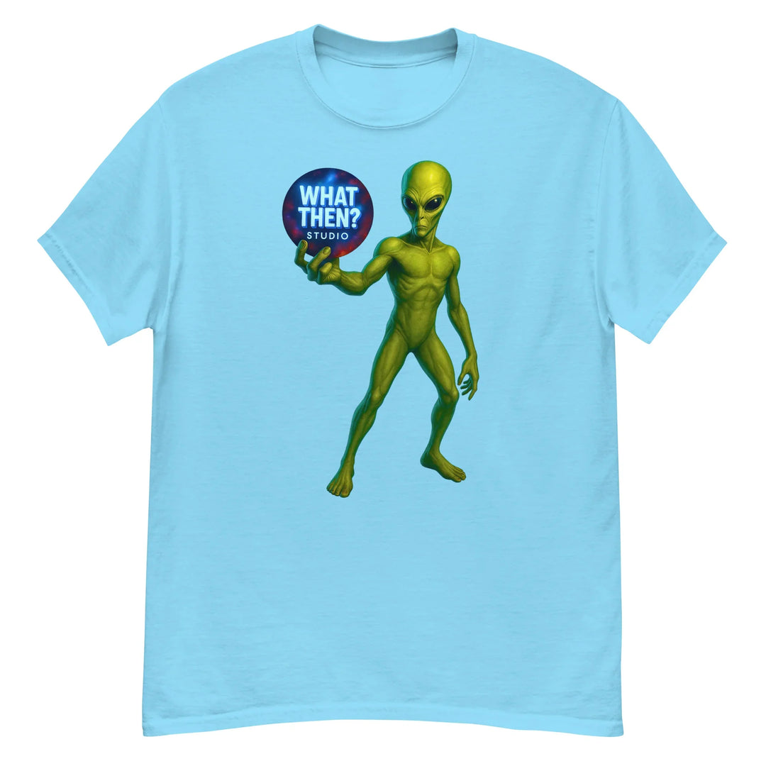Sky blue unisex t-shirt with green alien holding 'What Then? Studio' logo orb on front.