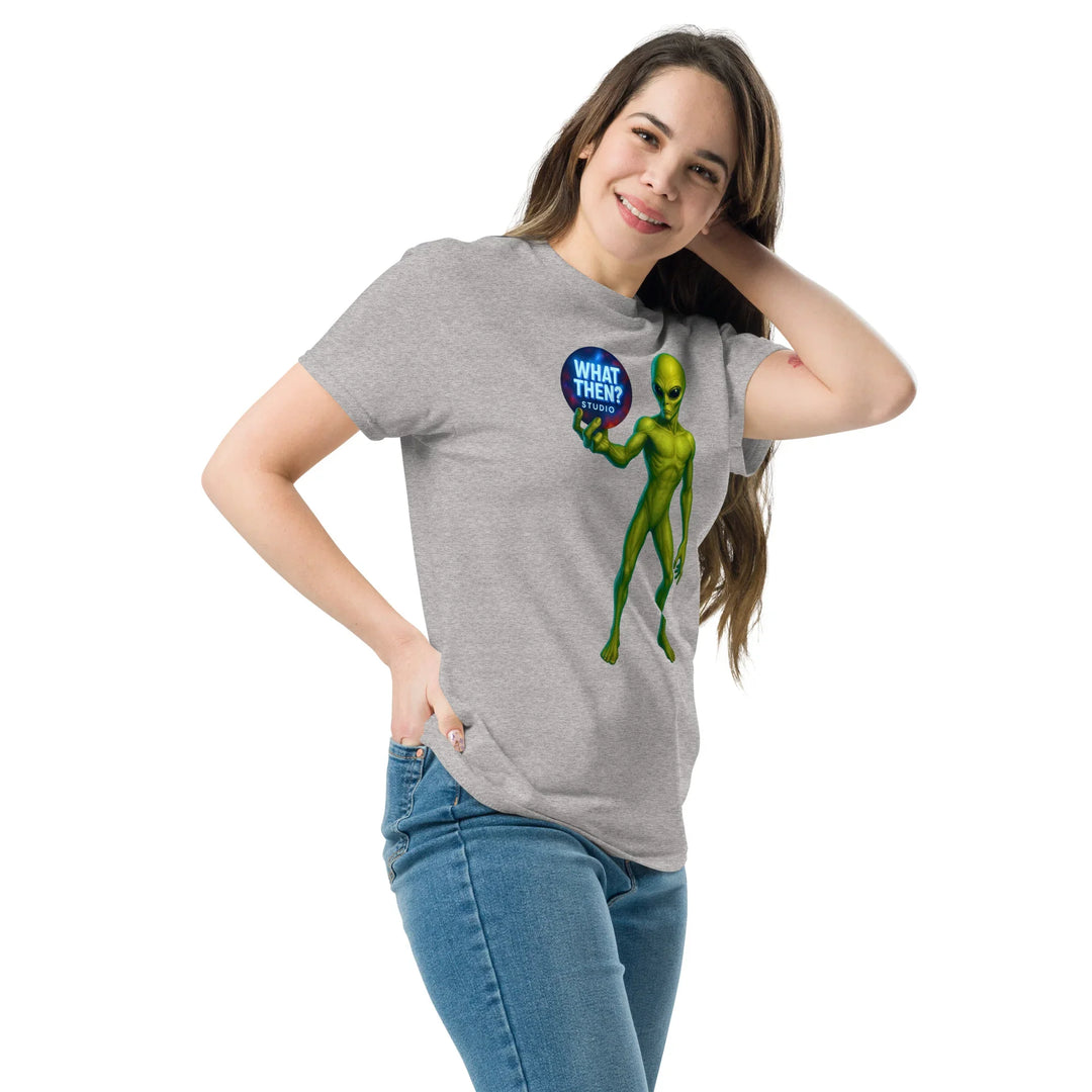Woman wearing grey What Then Studio t-shirt with green alien graphic and blue logo