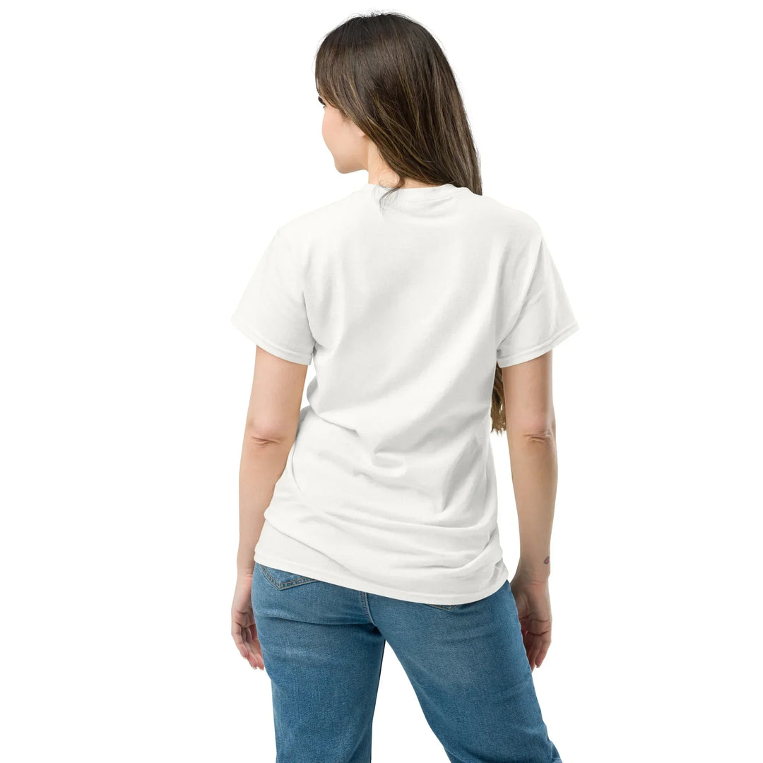 Woman wearing a What Then Studio unisex classic white tee, back view, with blue jeans