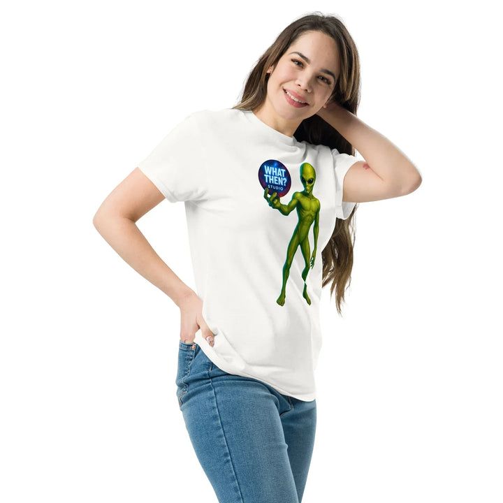 Woman wearing white What Then Studio t-shirt with green alien graphic and jeans