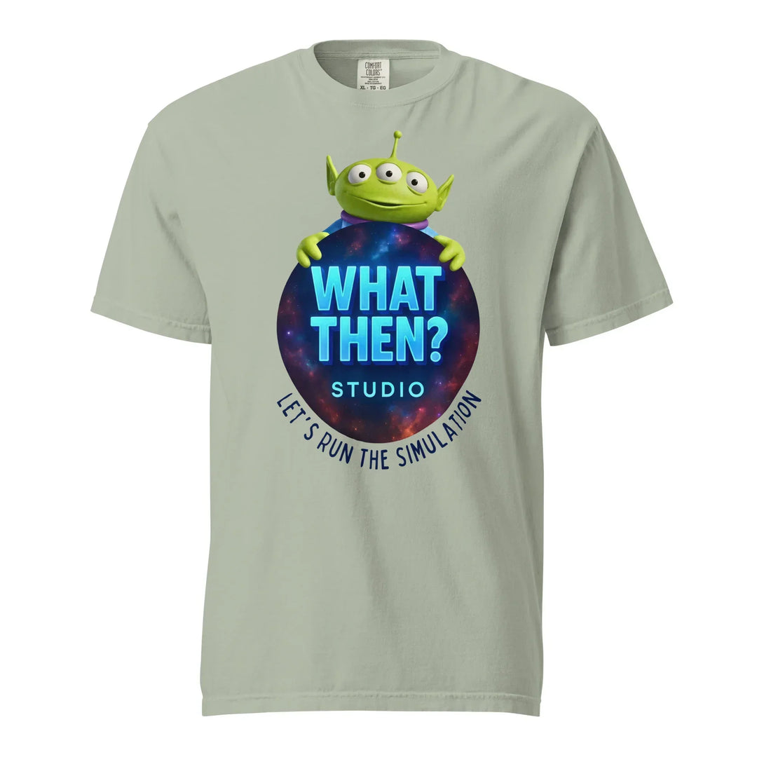 Unisex bay t-shirt with "What Then? Studio" logo, green alien graphic, and cosmic background.