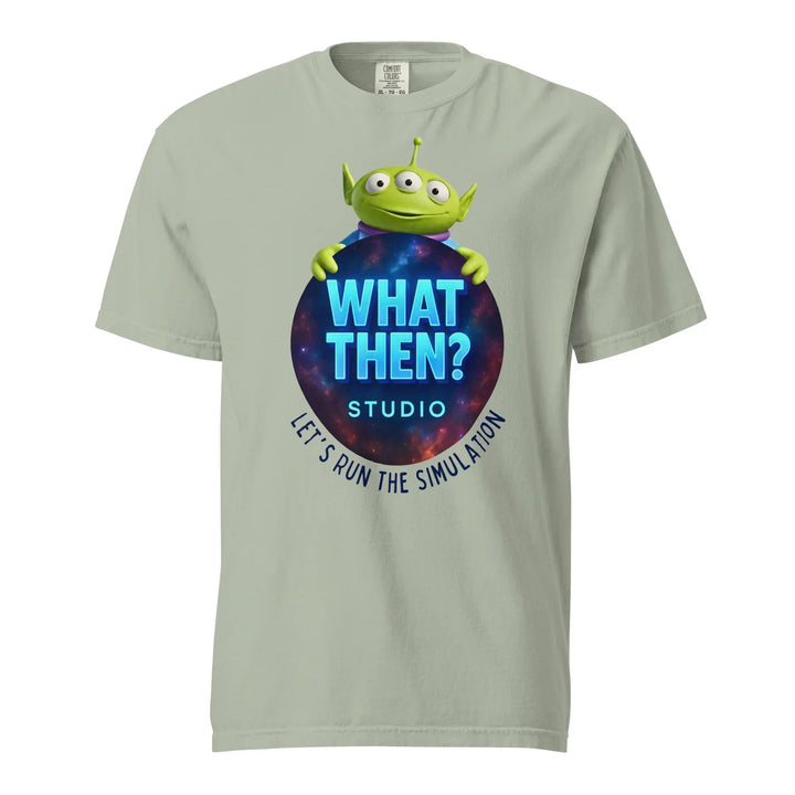 Unisex bay t-shirt with "What Then? Studio" logo, green alien graphic, and cosmic background.